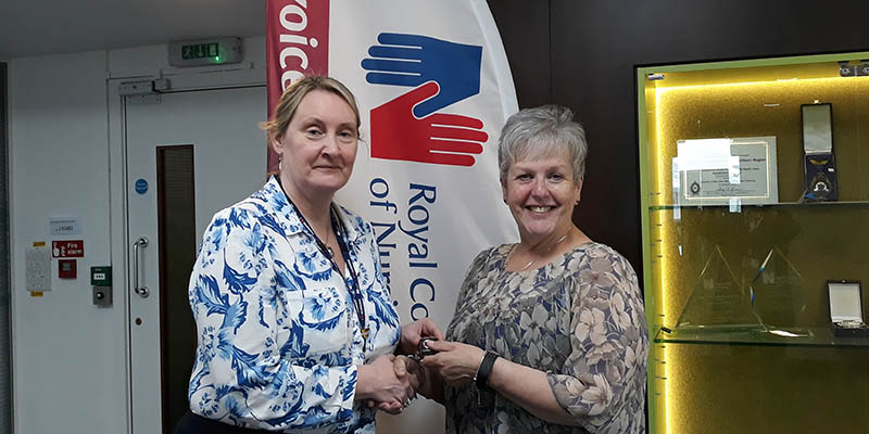 Margaret Wardrobe receiving her RCN long-service award from Operational Manager Peta Clark in 2019