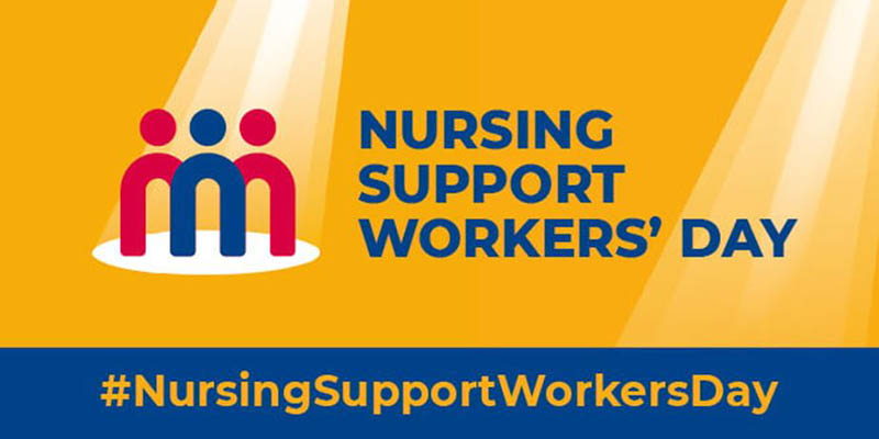 Orange rectangle, three nursing support worker 'stick men (two red with one blue in the middle) with a light shining on them, the words Nursing Support Workers' Day in navy blue and the hashtag #NursingSupportWorkersDay in orange text over a blue strip below