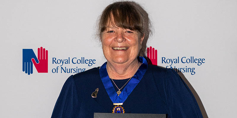 Vicky Brotherton at RCN Congress award ceremony having just received her medal and certificate for her Award of Merit 2023 800x400