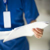Nurse holding paperwork