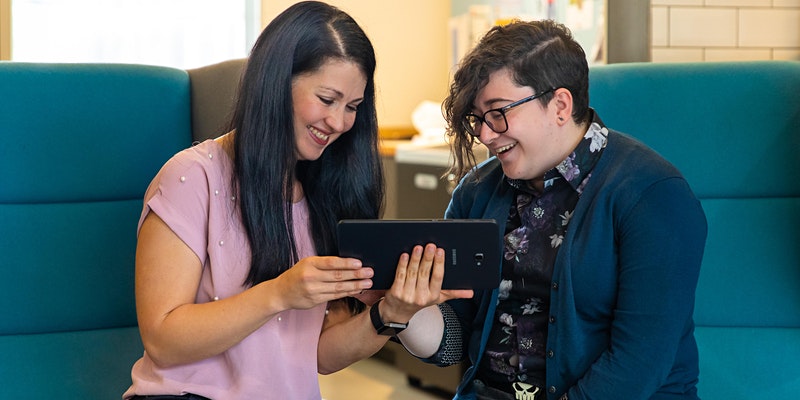 Two librarians discussing over a tablet (copyright RCN Library and Archive Service)