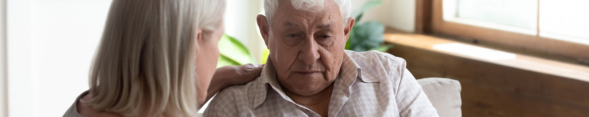 elderly man being comforted