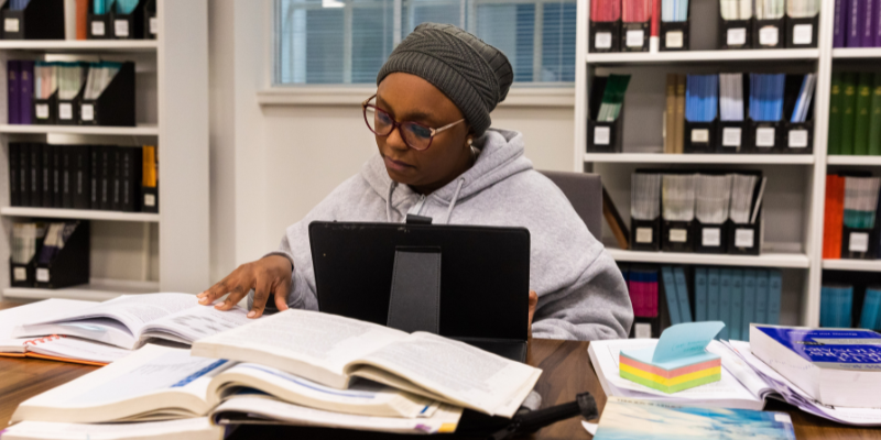 young person studying in the library