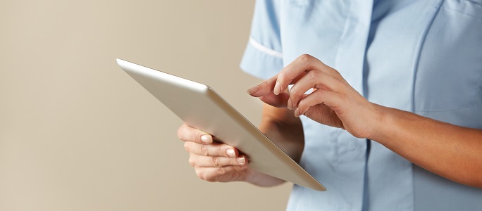 Nurse reading from a tablet