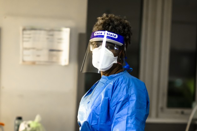 Nurse in PPE looking at camera