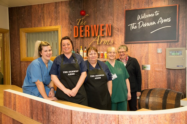 Staff and relative at the Derwen Arms at Ysbryd y Coed hospital
